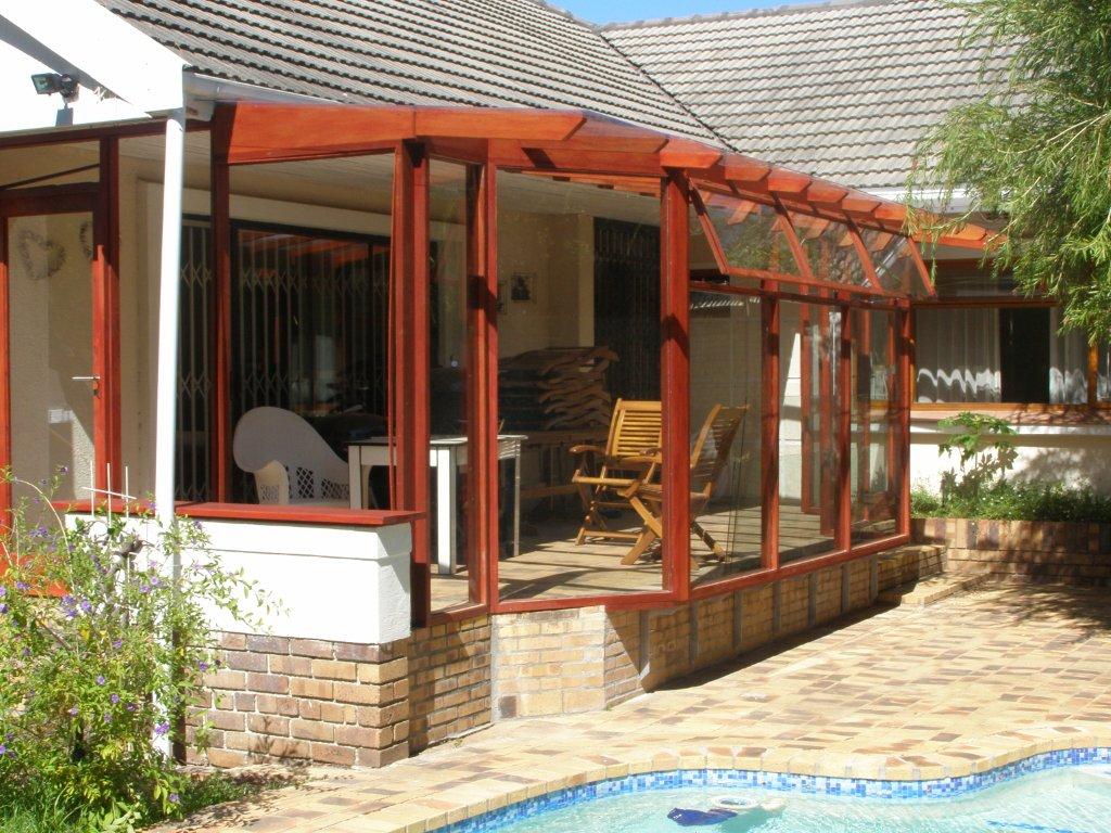 Wooden conservatory with glass.